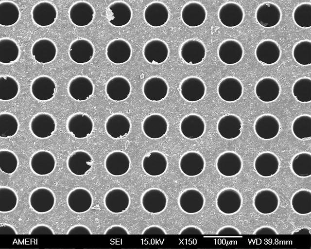 Top view of drilled polyimide wafer